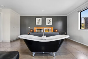 Blaze Rock Retreat villa interior with clawfoot bath and mountain views, Grampians Victoria